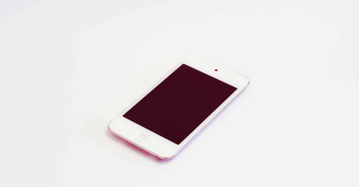 White electronic touch device on a plain surface, showcasing minimalist technology design.