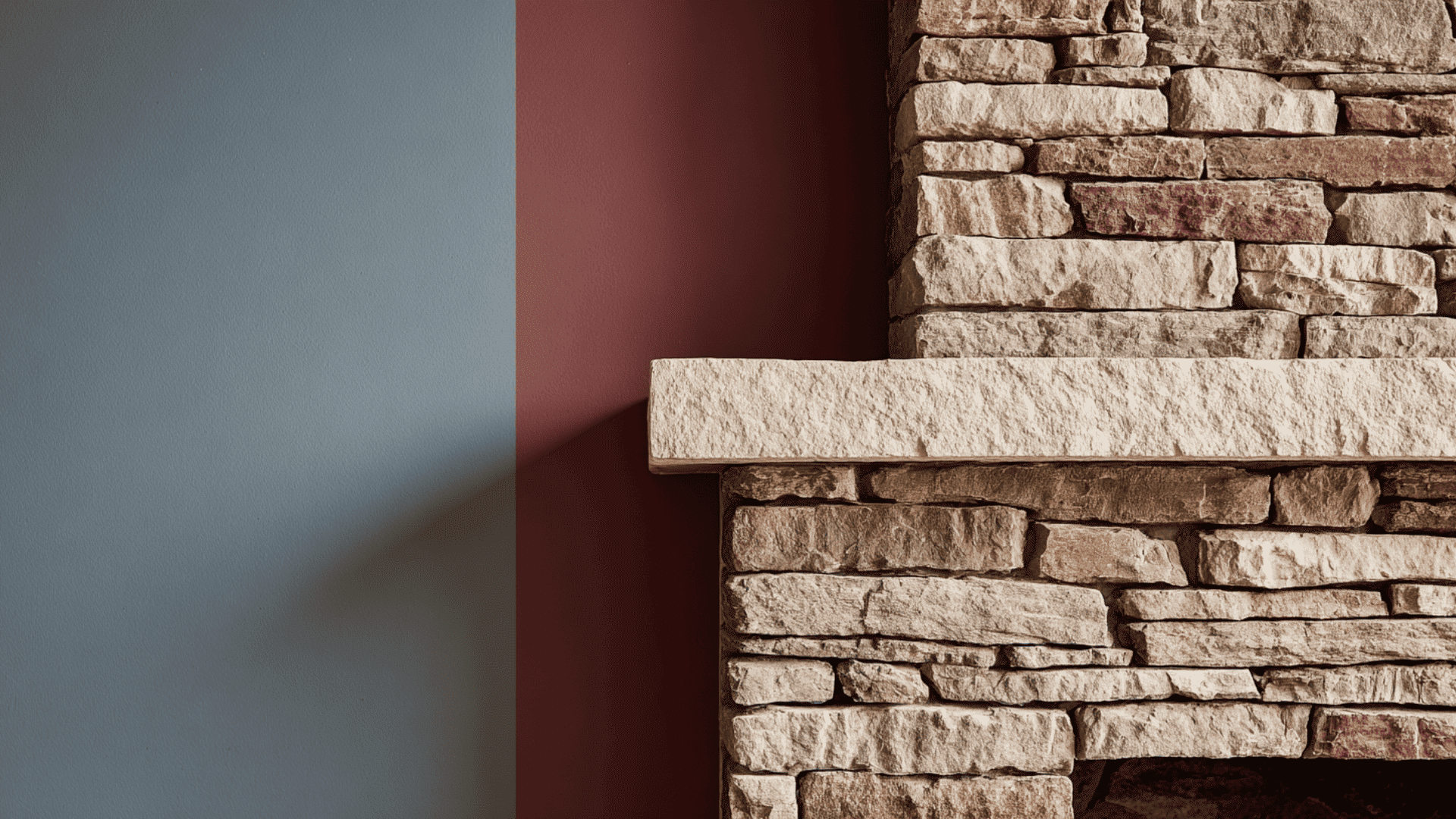 stone fireplace paired with a coordinating accent wall color