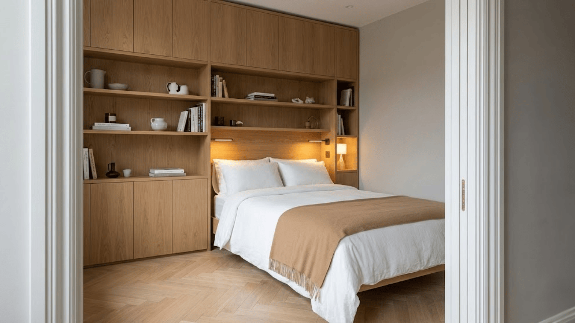 storage wall behind the bed