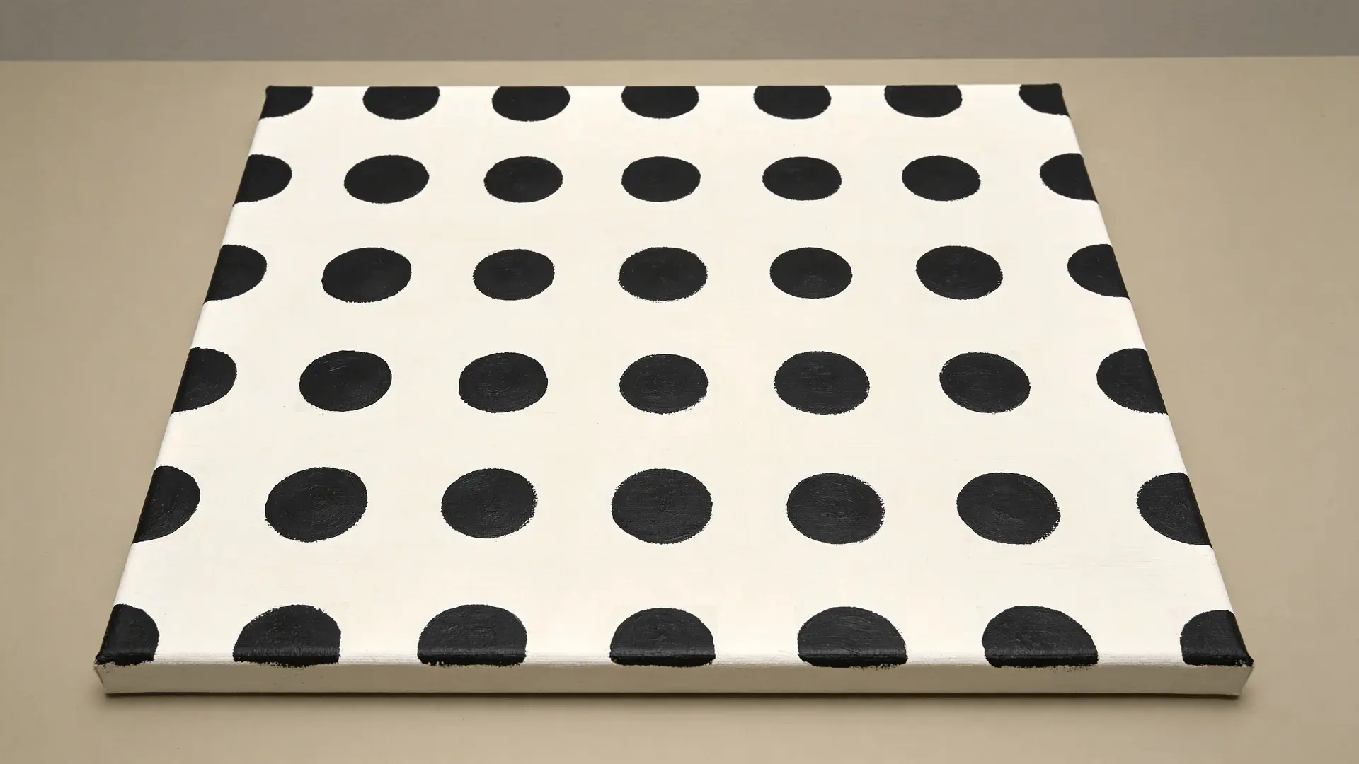 Canvas with evenly spaced painted dots on a solid background