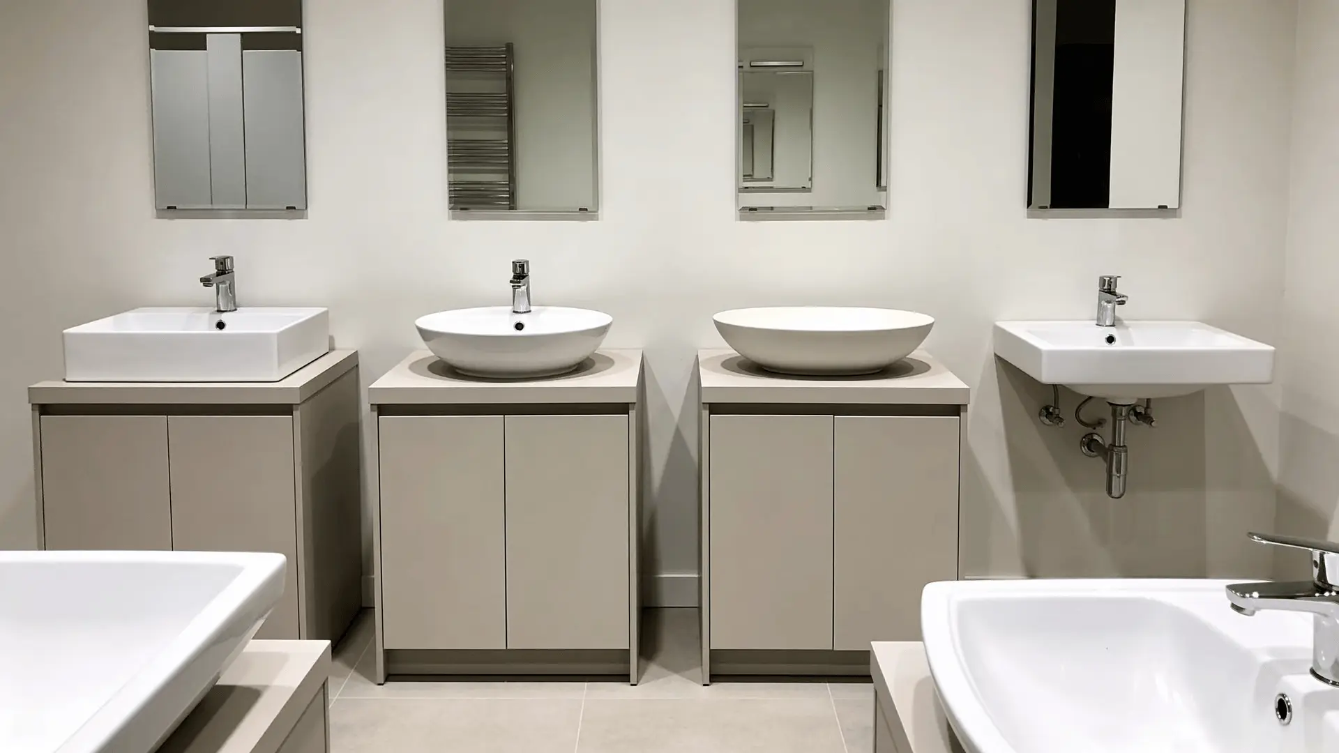 Different bathroom sink shapes displayed on neutral vanities