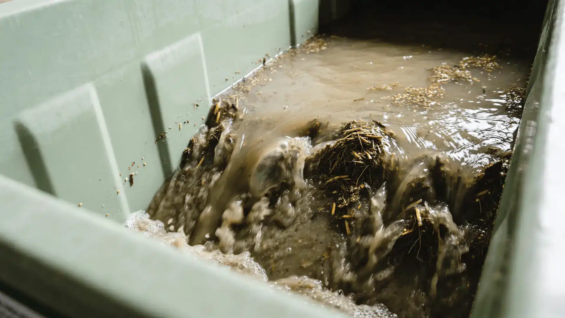 Hydroseeding materials mixed into a wet slurry inside a tank