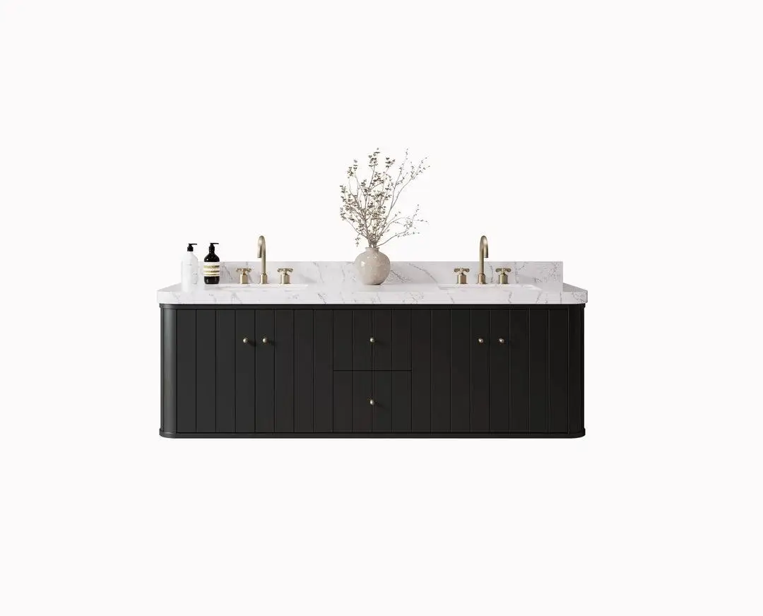 Black vanity with marble countertop, brass faucets, and decorative vase in minimalistic setting