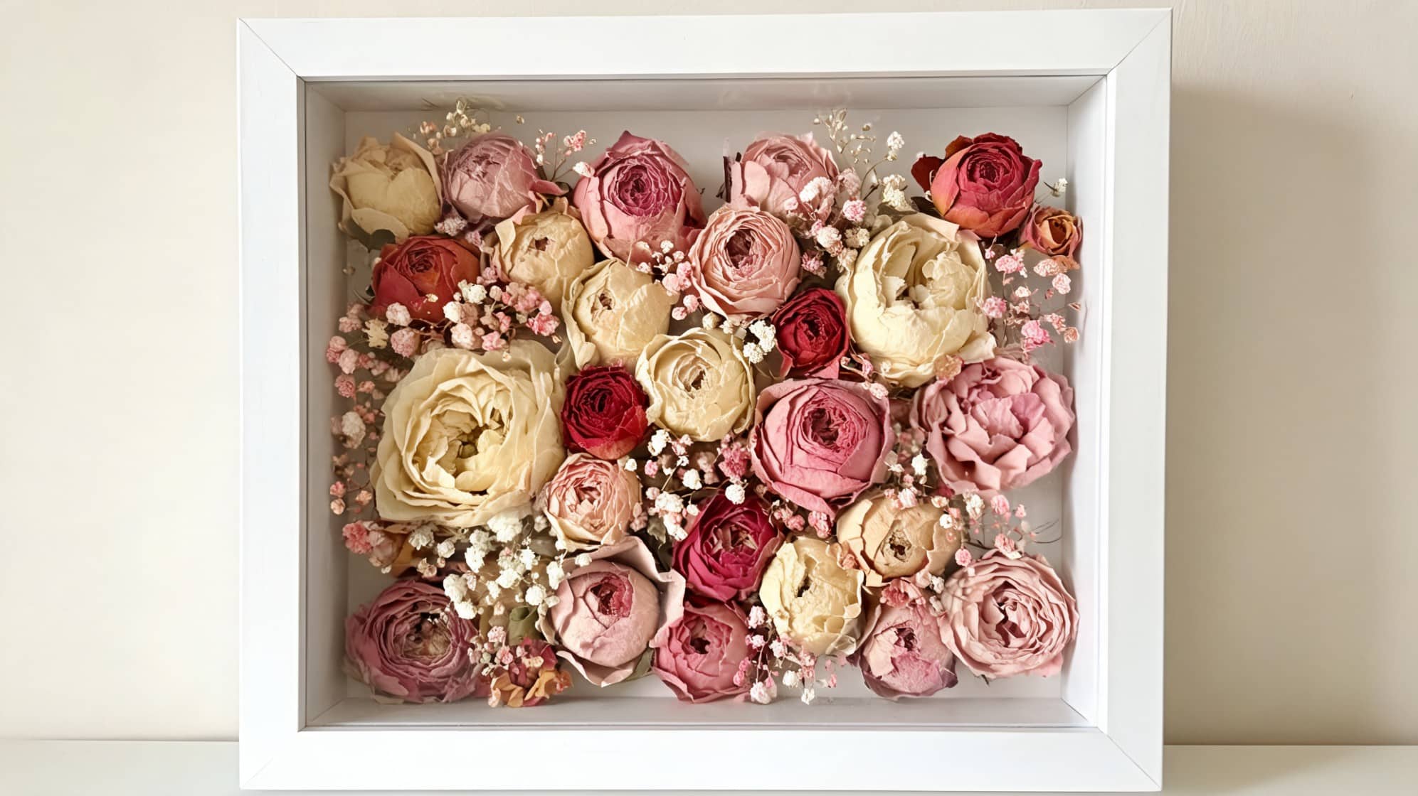 shadow box with dried roses for how to preserve flowers
