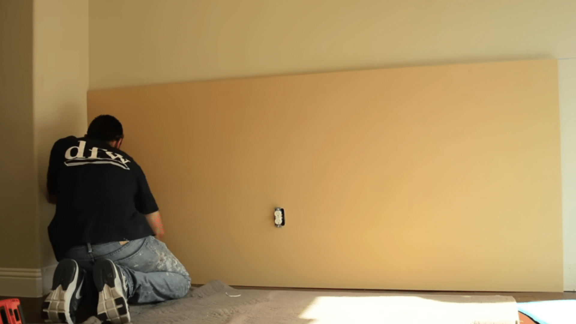 cutting mdf backing sheets and pressing them onto the lower wall with adhesive for deeper panel detail