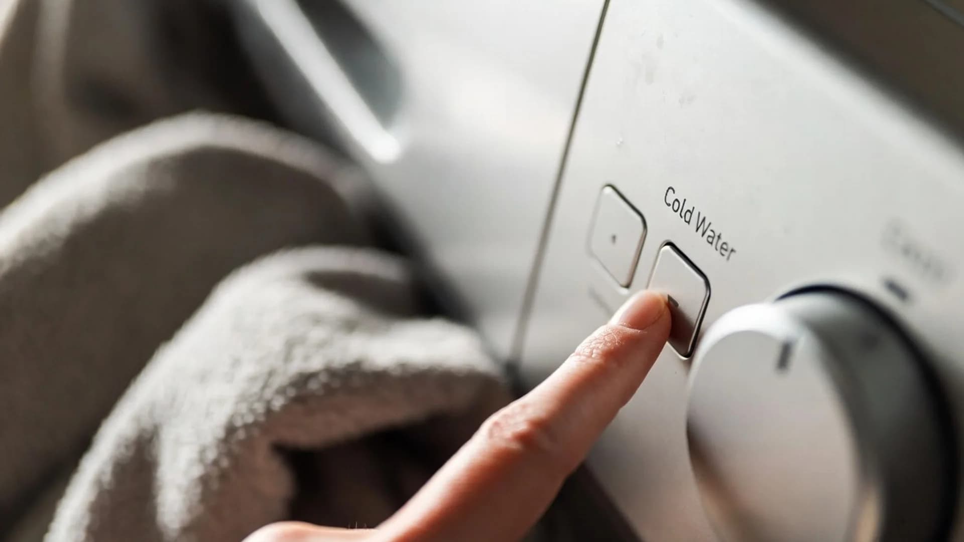 washer control set to cold water for cleaning a heated blanket with safer gentle settings