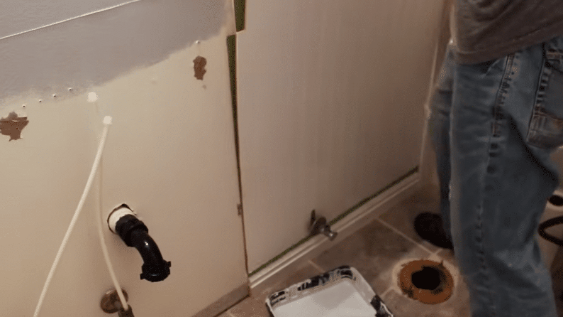 marking and cutting beadboard around pipes outlets counters and vanity edges before fastening it to the wall