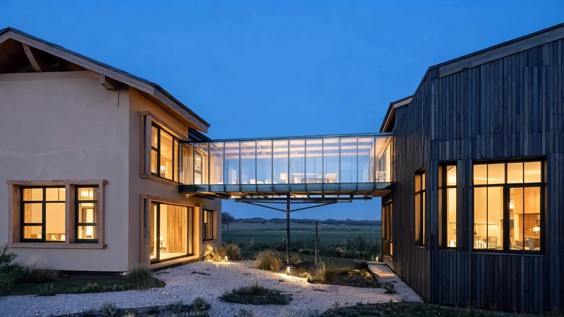 modern farmhouse exterior with cantilevered glass bridge connecting two volumes and warm interior lighting at blue hour