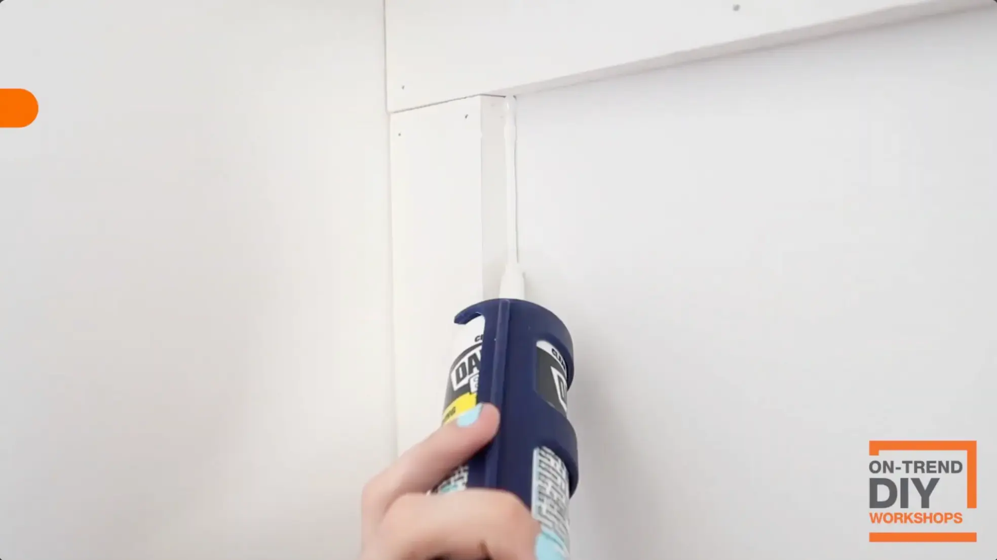 sealing gaps with caulk on board and batten wall