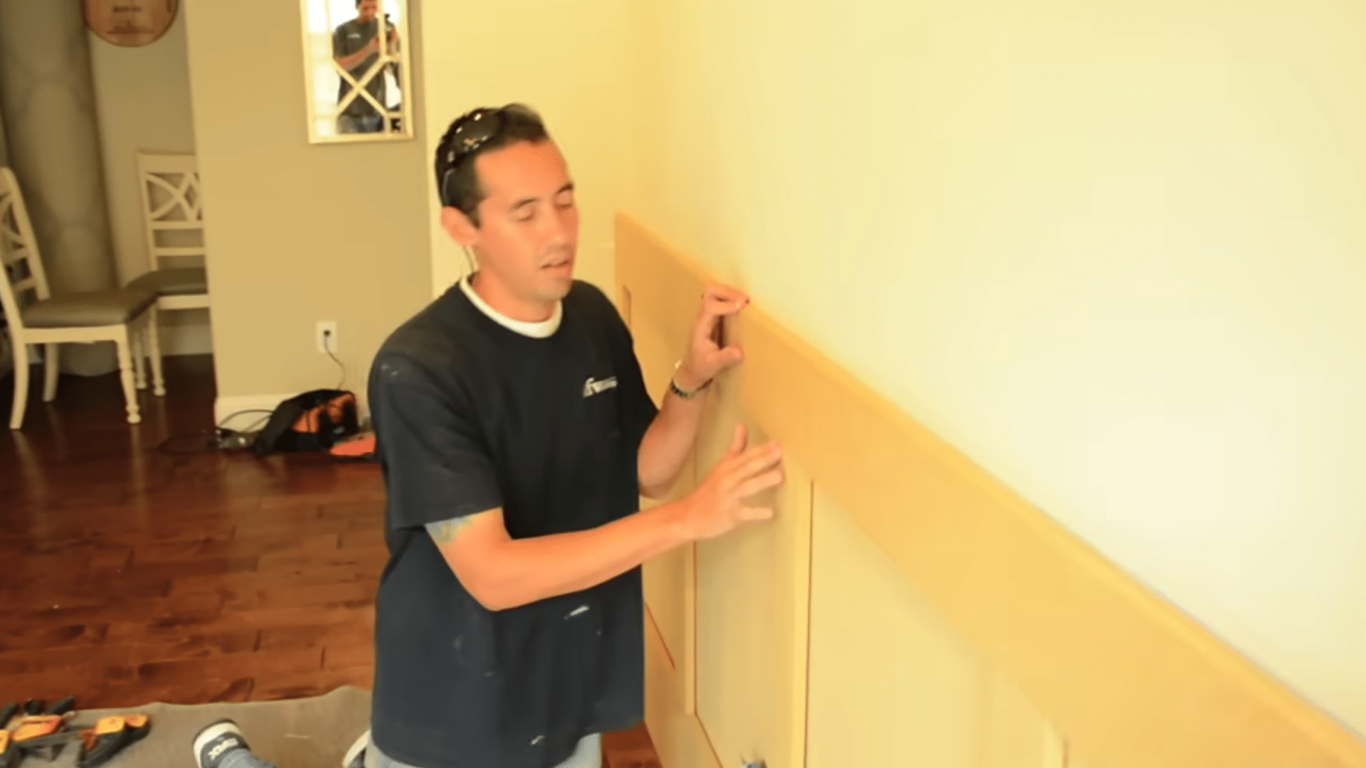 setting the wainscoting frame on the mdf backing and nailing it where trim will hide the nail holes later (1)