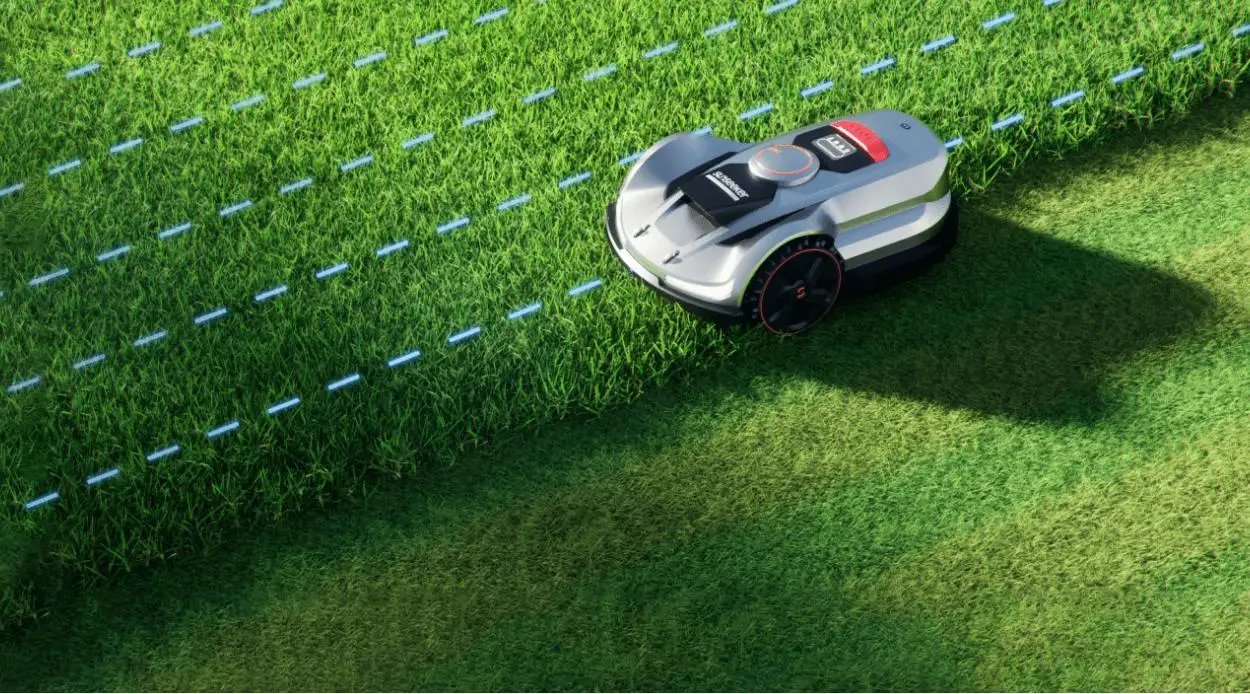 Robotic lawn mower trimming grass in sunny outdoor garden setting