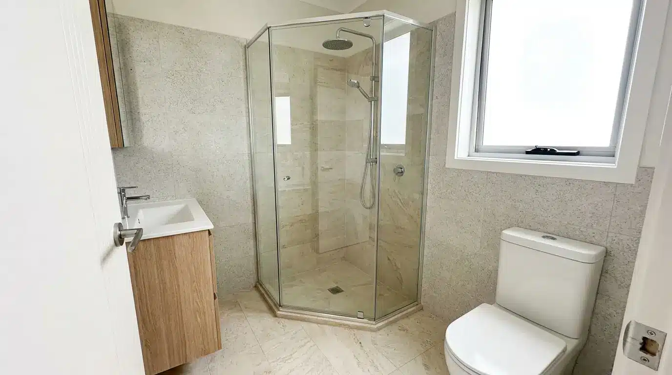 corner shower bathroom layout with vanity near entry toilet side wall and open floor