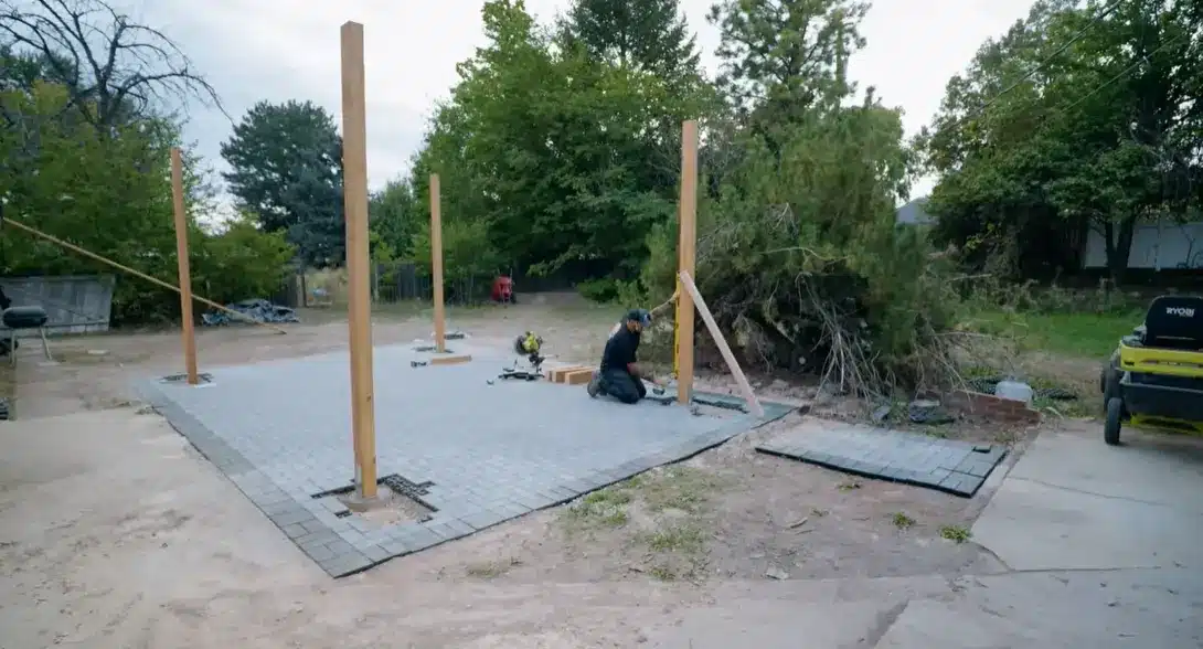 cutting the main horizontal beams to length and attaching them across the top of the posts