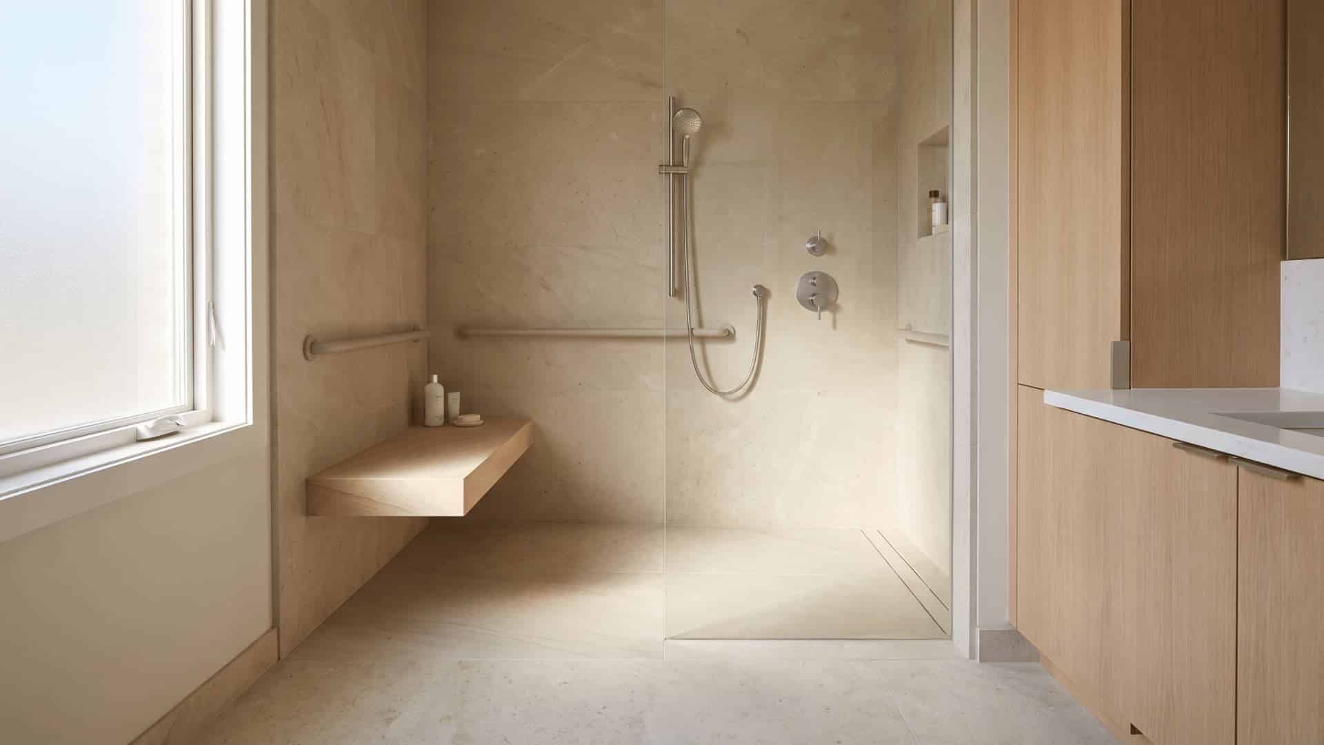 curbless shower with bench, grab bars, handheld spray, and recessed niche