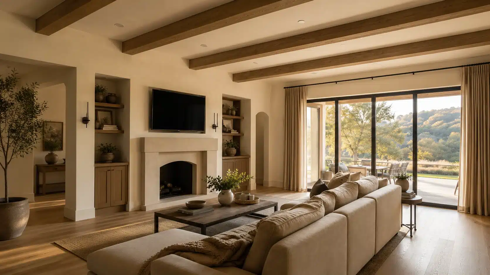 modern living room with exposed wood beam ceiling and large glass windows overlooking nature