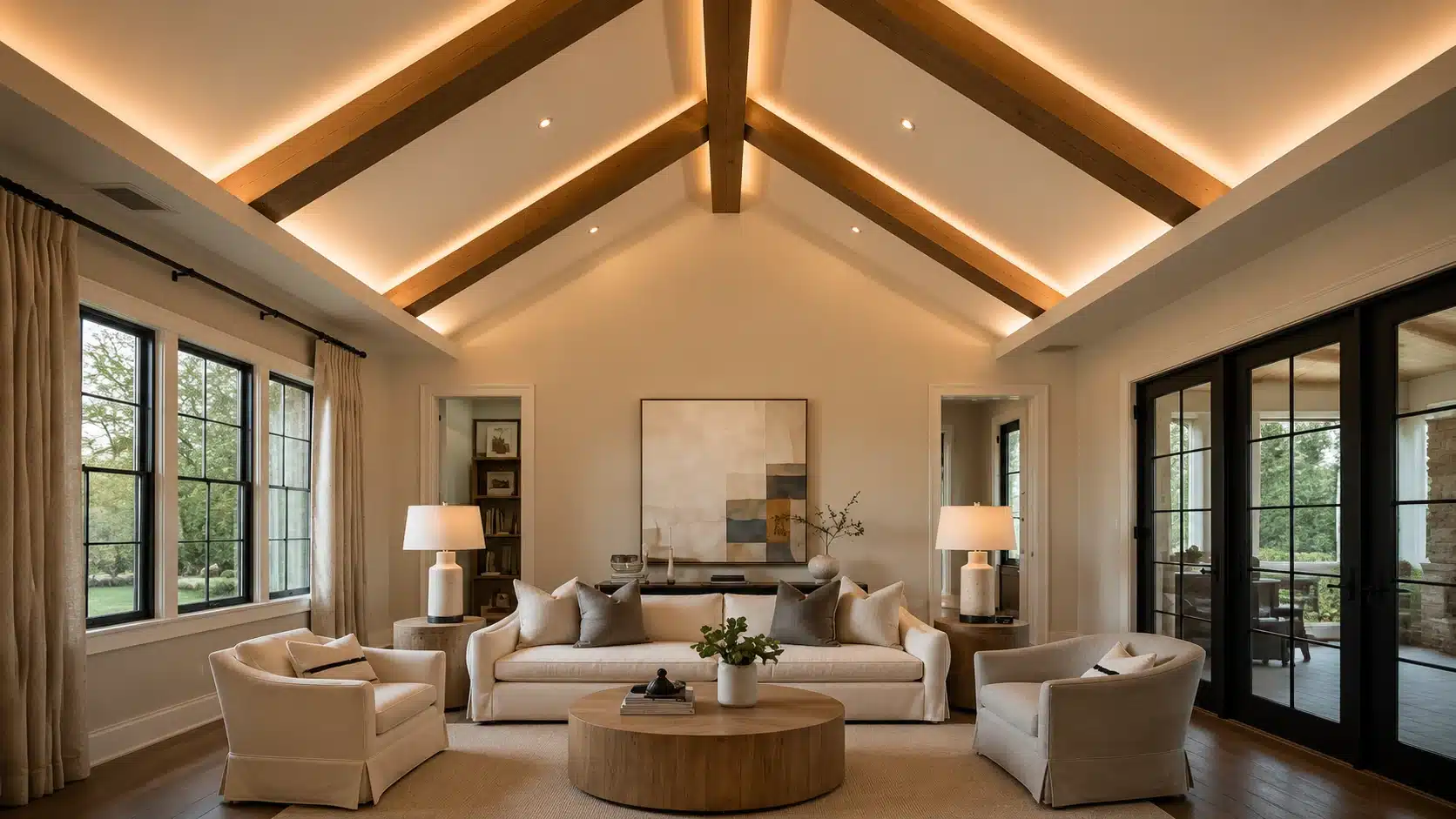 vaulted cathedral ceiling with exposed wooden beams and soft lighting in a spacious living room